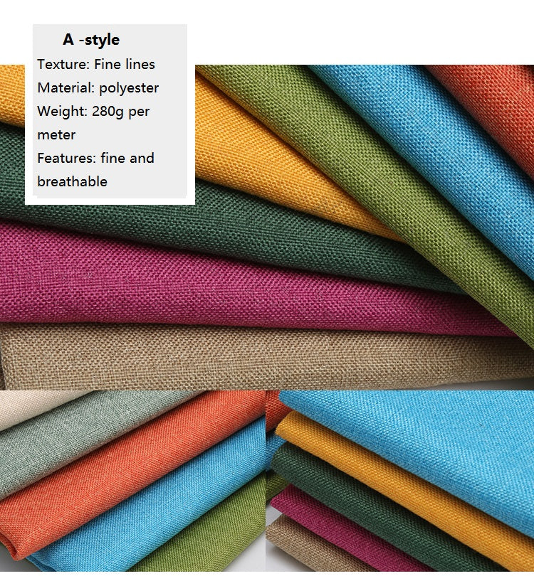 A stack of various colored coarse linen and cotton fabric rolls shown in close-up.