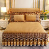 A luxurious brown velvet bed skirt with intricate floral embroidery and scalloped edges displayed on a bed.