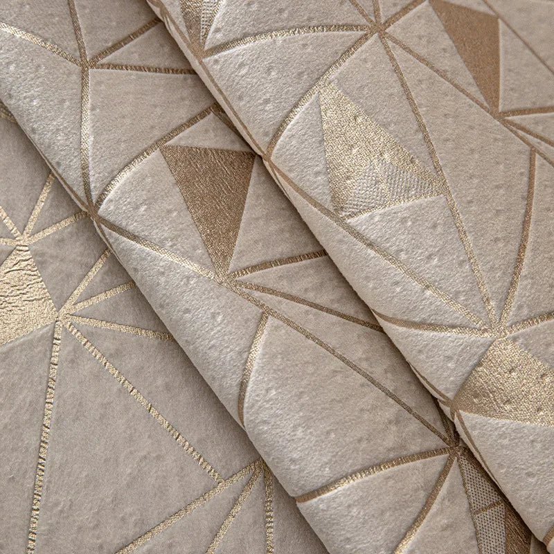 Close-up of a beige luxury chenille sofa cover featuring a geometric pattern with gold metallic accents.