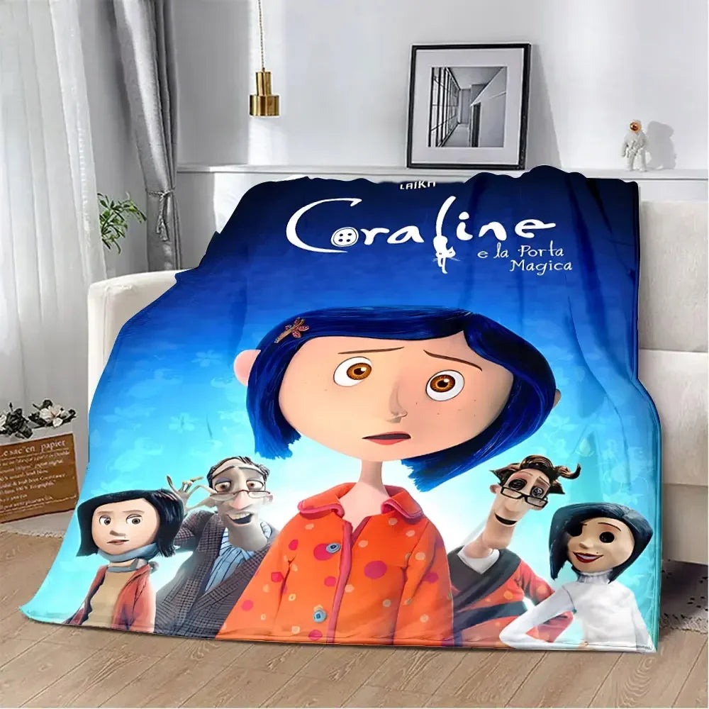 An animated print blanket featuring characters from Coraline and the Magic Door.
