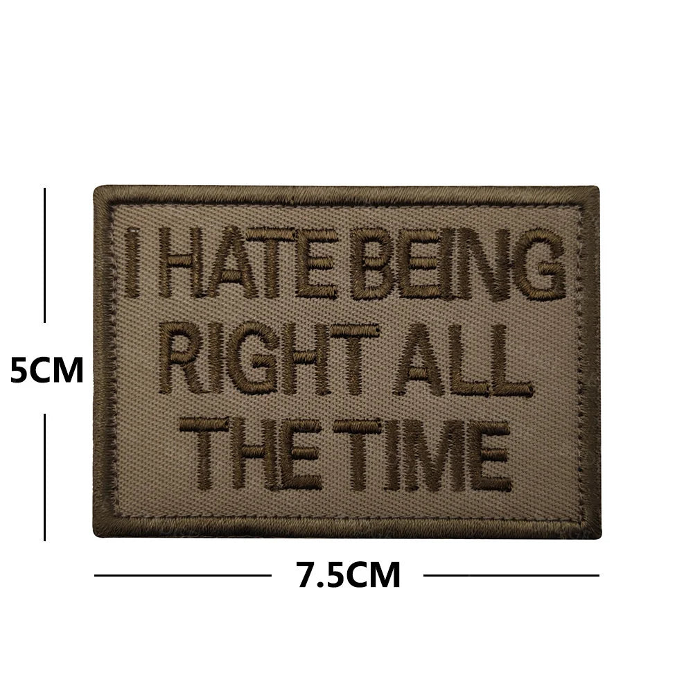 A rectangular brown embroidered patch with the text I HATE BEING RIGHT ALL THE TIME stitched in dark thread.