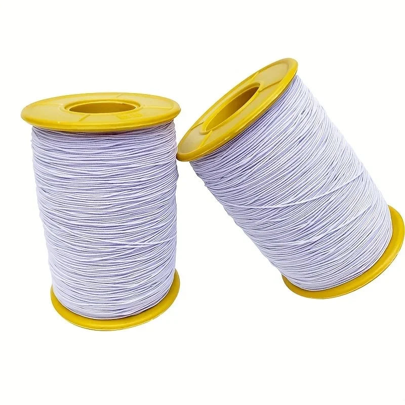 Spool of purple elastic sewing thread with a yellow plastic core