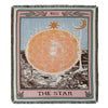 A textile featuring a celestial design of a star and moon on an orange background with dark earth below.