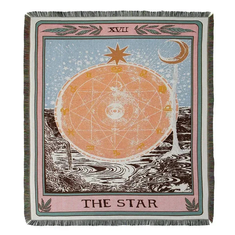 A textile featuring a celestial design of a star and moon on an orange background with dark earth below.