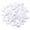 A pile of white satin ribbon bows for craft and decoration.