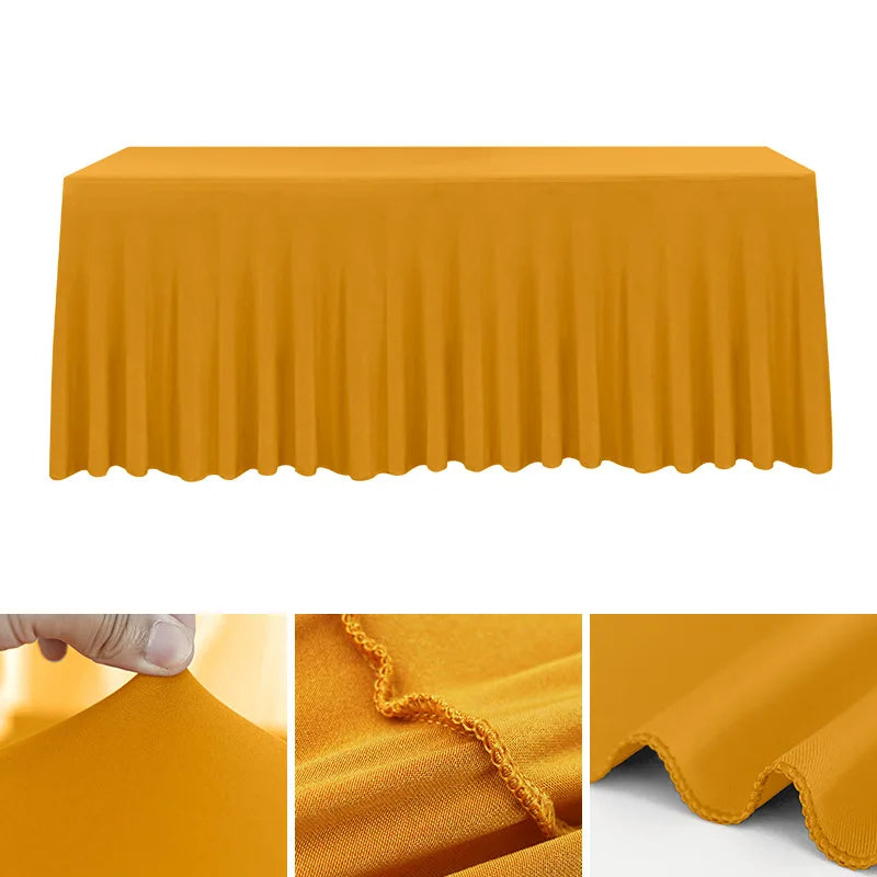 A smooth, mustard yellow stretchable waterproof rectangle tablecloth draped over a table.