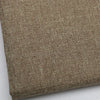 Close-up texture of coarse linen and cotton fabric in a natural beige or olive green color.