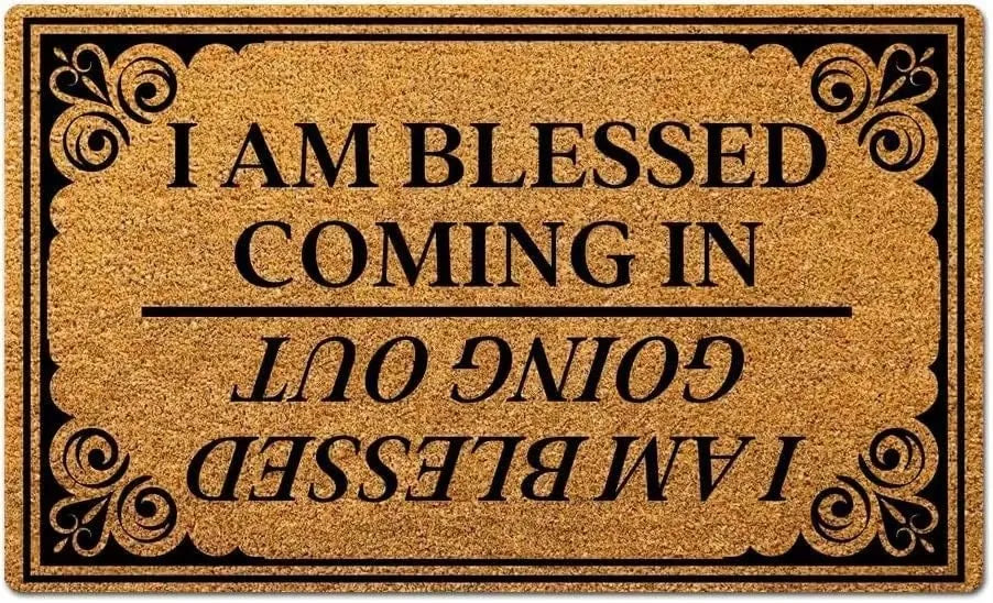 A gold glitter doormat with black text that reads I AM BLESSED COMING IN GOING OUT I AM BLESSED
