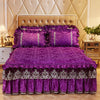 A purple bed skirt set featuring a ruffled fabric and matching pillowcases on a bed with a tufted headboard.