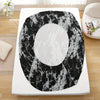 Black and white marble print fitted sheet set displayed on a white surface.