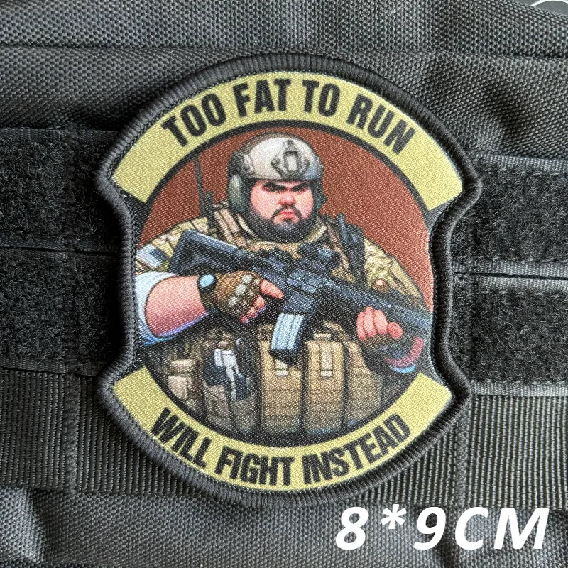 A tactical military patch featuring a man with a beard holding a rifle, with the text Too Fat to Run Will Fight Instead.