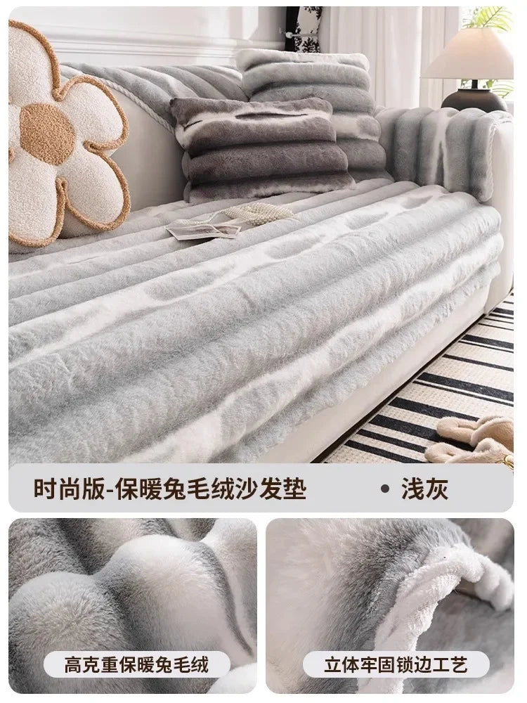 Gray striped anti-slip plush sofa cover draped over a sofa with decorative pillows.