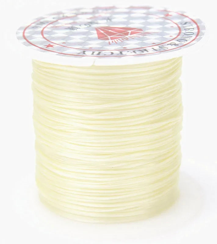 A spool of multicolor elastic beading cord with a patterned label.