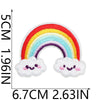 A white cloud patch with a rainbow design embroidered on it.
