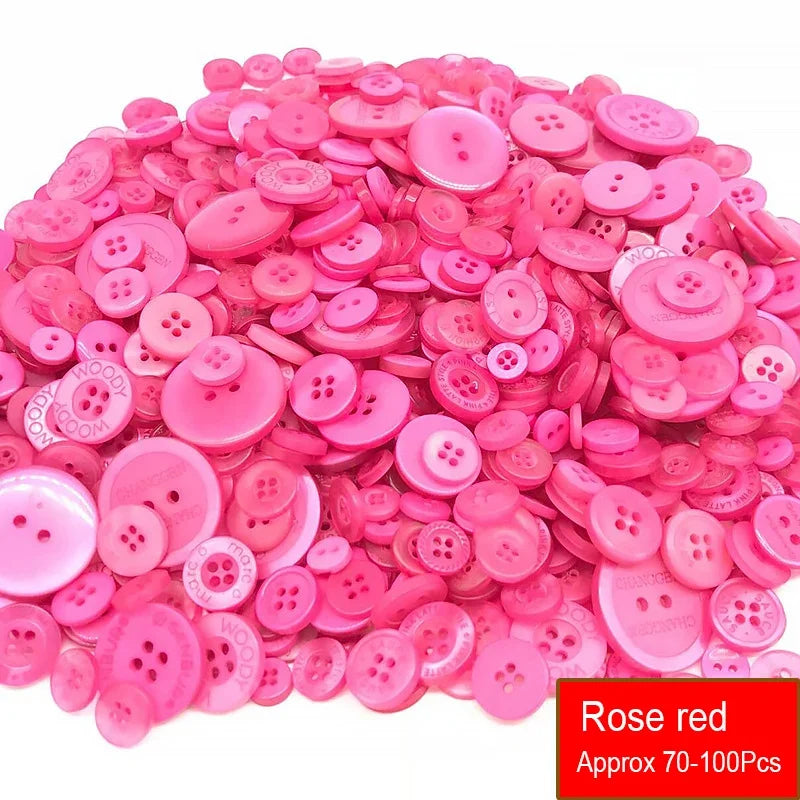 A pile of assorted rose red plastic resin sewing buttons for crafting and DIY projects