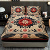 A floral print fitted sheet set with pillowcases featuring red, pink, and green patterns on a bed.