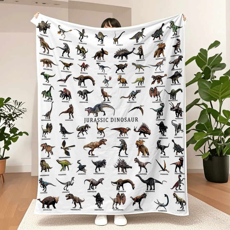 A large flannel throw blanket featuring various Jurassic dinosaur illustrations.