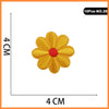 A single yellow embroidered flower patch with a red center, part of a set of iron-on patches.