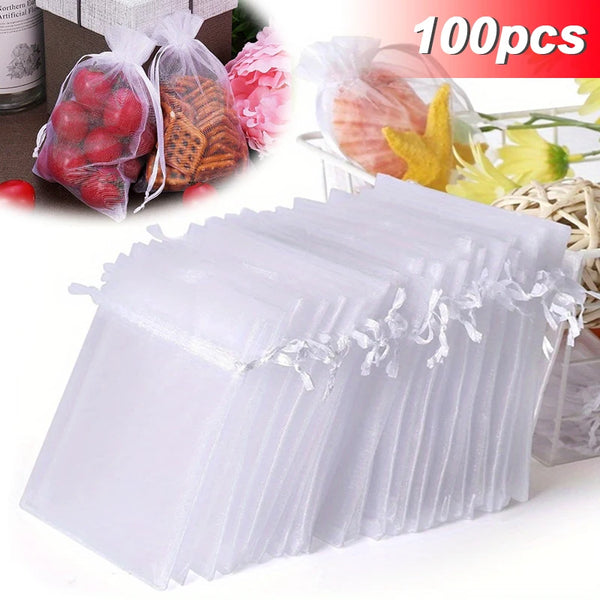A bulk pack of clear mesh organza drawstring jewelry bags with colorful floral accents.