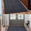 A self-adhesive striped runner rug laid out on a wooden floor in a hallway.