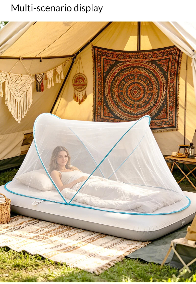 A portable mosquito net is set up inside a tent, providing a screened sleeping area for outdoor use.