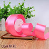 Roll of pink satin ribbon for gift wrapping and DIY crafts