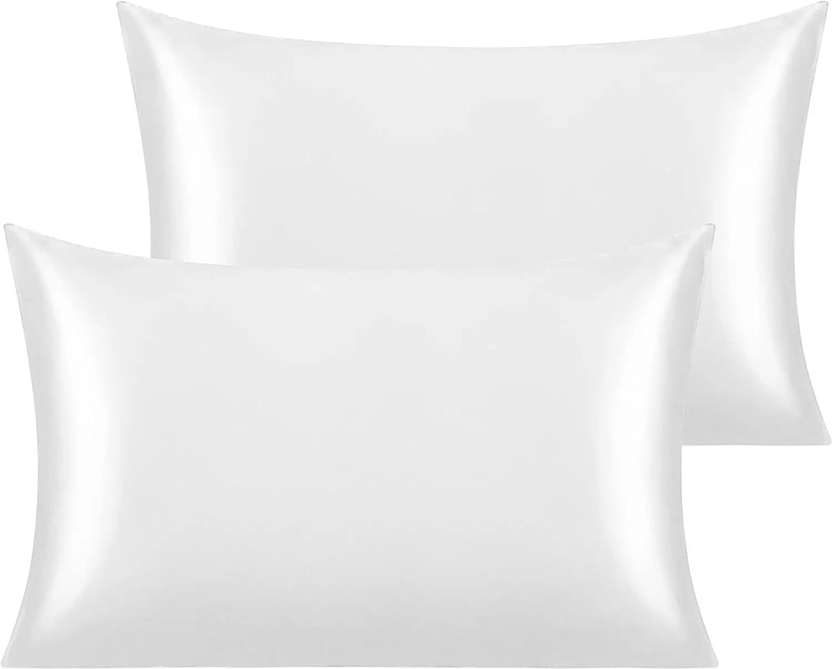 A white silky satin toddler pillowcase shown in a folded or draped manner.