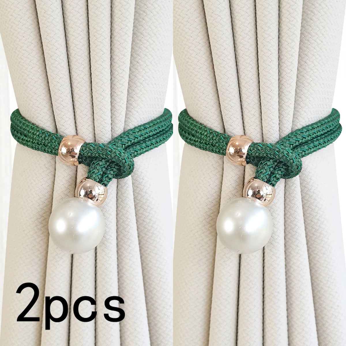 Two sets of green artificial pearl curtain tie-backs with gold accents against a light beige fabric.