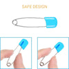 A close-up view of a stainless steel diaper pin with a blue safety locking closure.