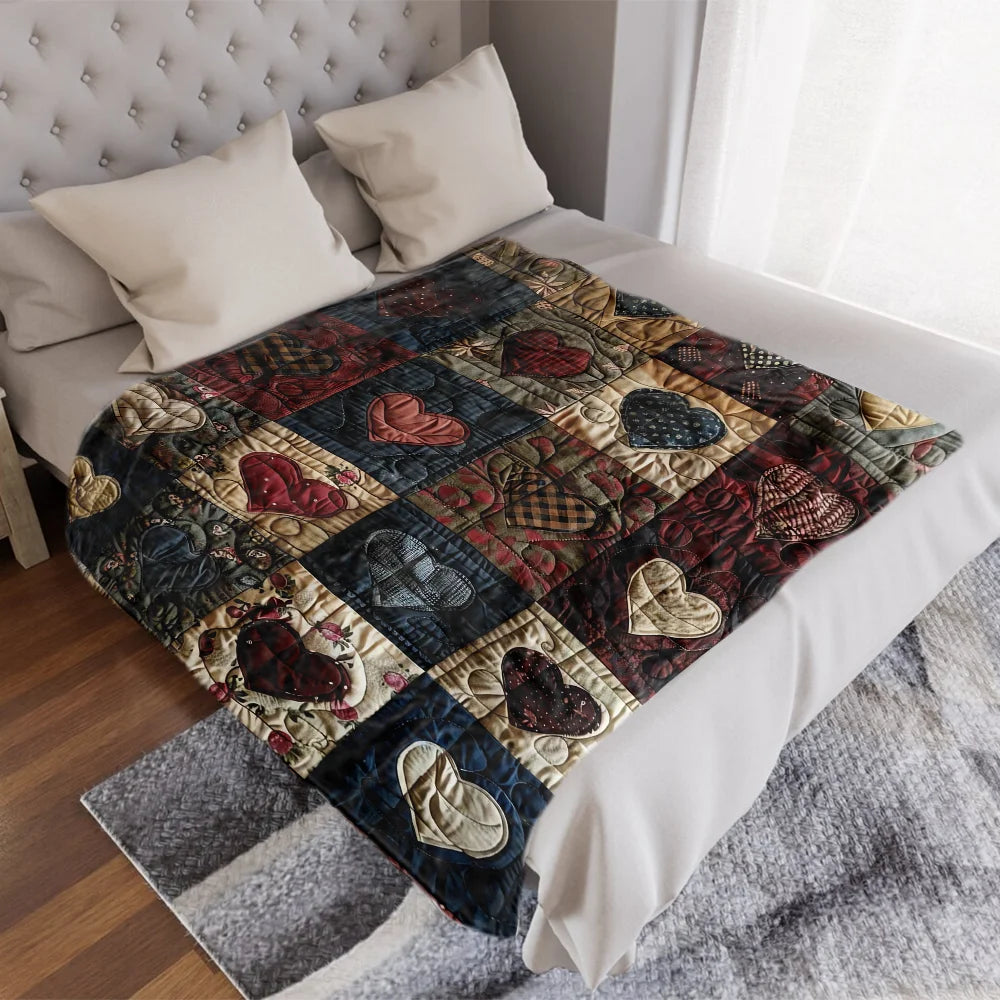 A cozy heart-print flannel throw blanket folded on a white bed with pillows.
