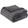 A dark gray striped flannel throw blanket folded and bundled for cozy comfort