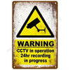 A vintage metal warning sign with a yellow triangle and black symbol indicating active CCTV 24hr recording.