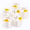 Rolls of transparent elastic cord for jewelry making with various diameters labeled on the packaging
