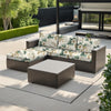 A dark brown outdoor sofa with floral patterned cushions placed on a light gray deck.