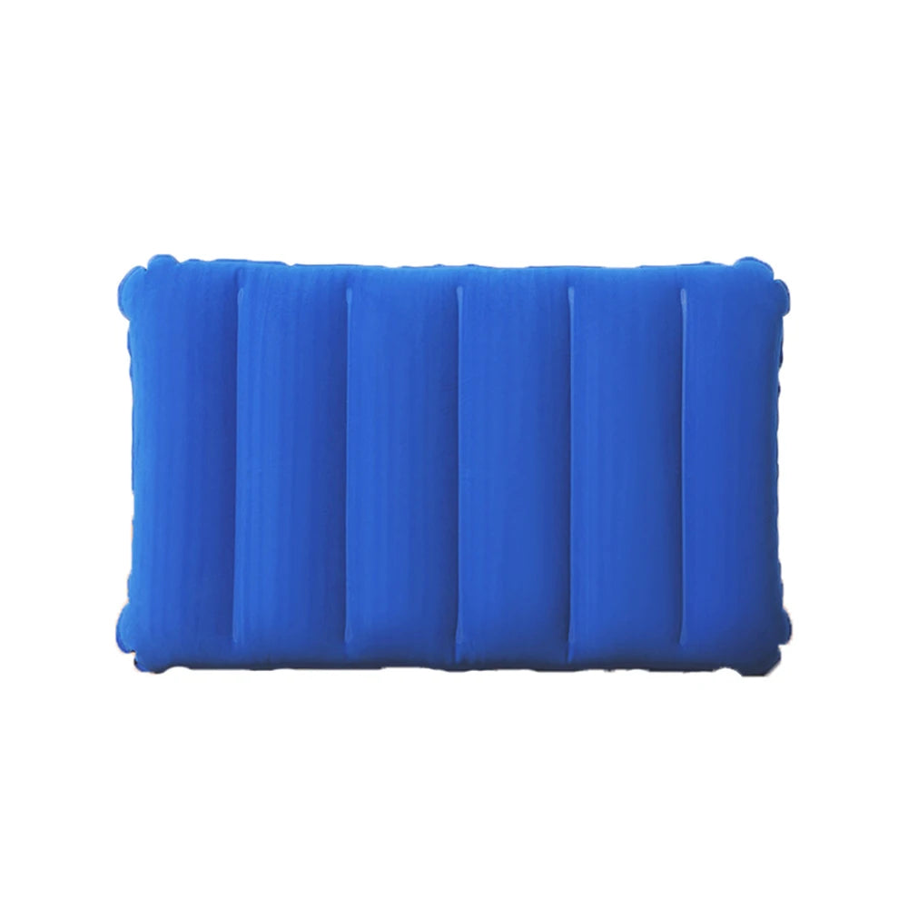 A bright blue portable inflatable travel pillow with ribbed texture.