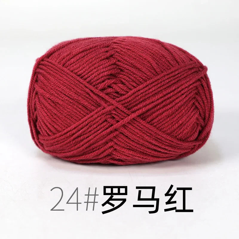 A ball of deep red knitting yarn labeled 24# in Chinese characters for crafts.