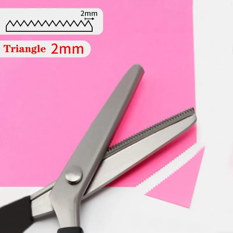 A pair of professional stainless steel tailor's shears with a triangle-shaped cutting edge shown against pink paper.