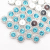 Silver and blue crystal rhinestone sew-on buttons arranged in a sunflower pattern