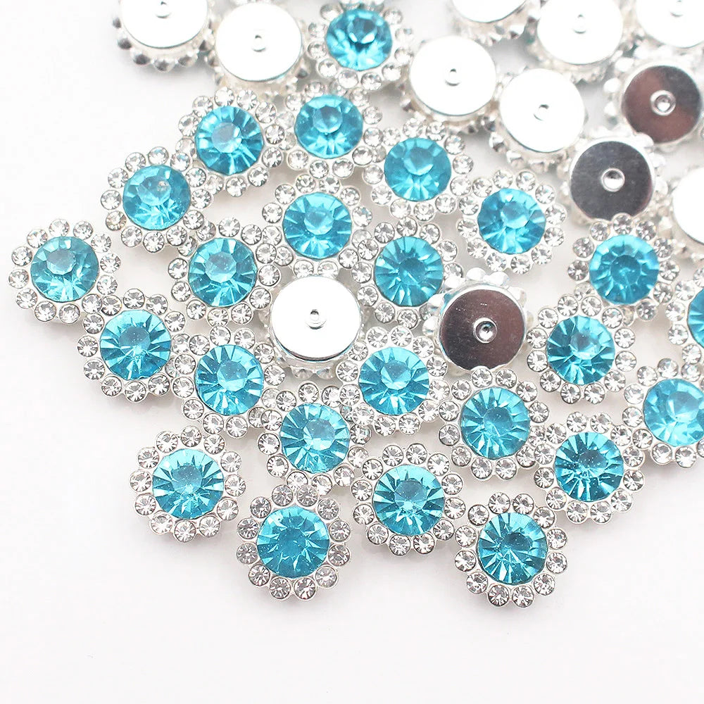 Silver and blue crystal rhinestone sew-on buttons arranged in a sunflower pattern