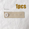 Brown elastic waist extender belt with a white button shown on a white fabric background.