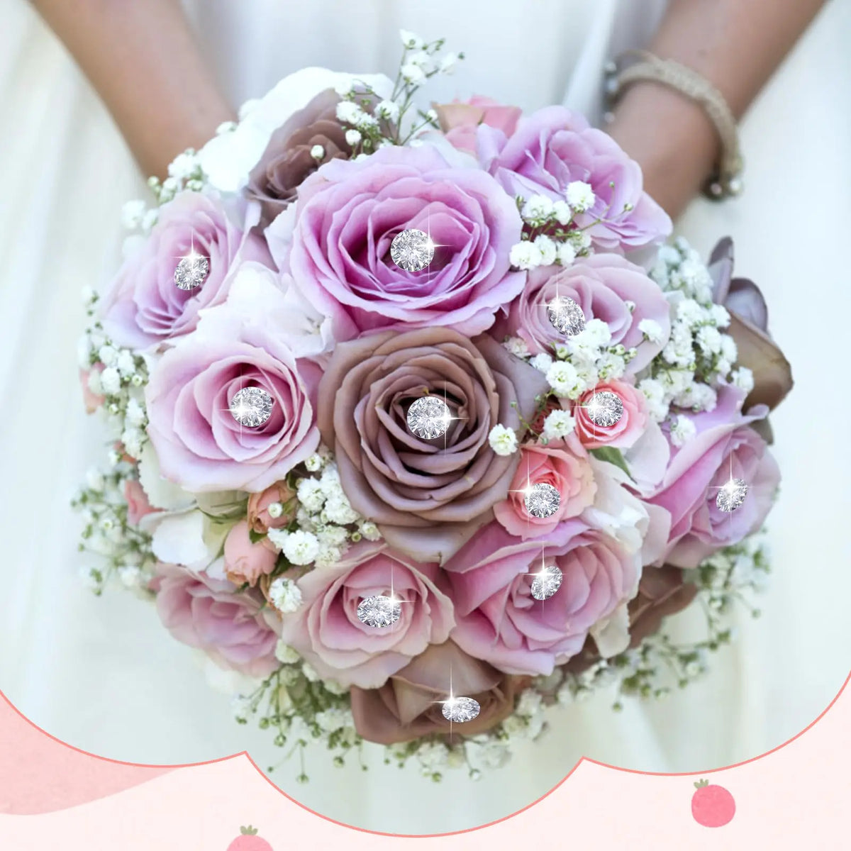 A bridal bouquet featuring pink and mauve roses accented with small white flowers and sparkling diamond pins.