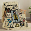 A beige flannel throw blanket featuring a black line drawing of a girl and various whimsical illustrations.