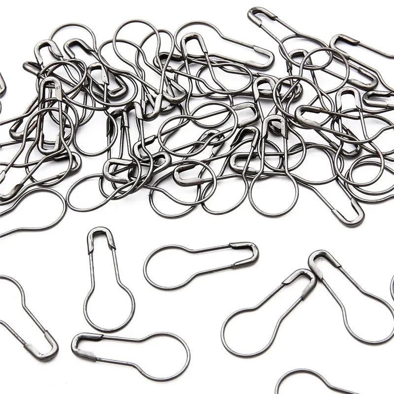 A pile of colorful safety bulb pins for knitting and sewing used for various crafts.