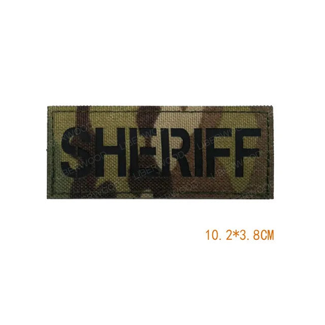Olive drab fabric patch embroidered with the word SHERIFF