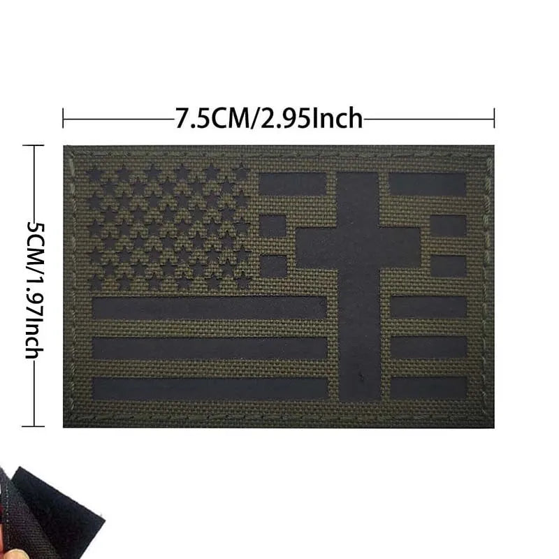 A dark olive green embroidered patch featuring a cross and flag designs.