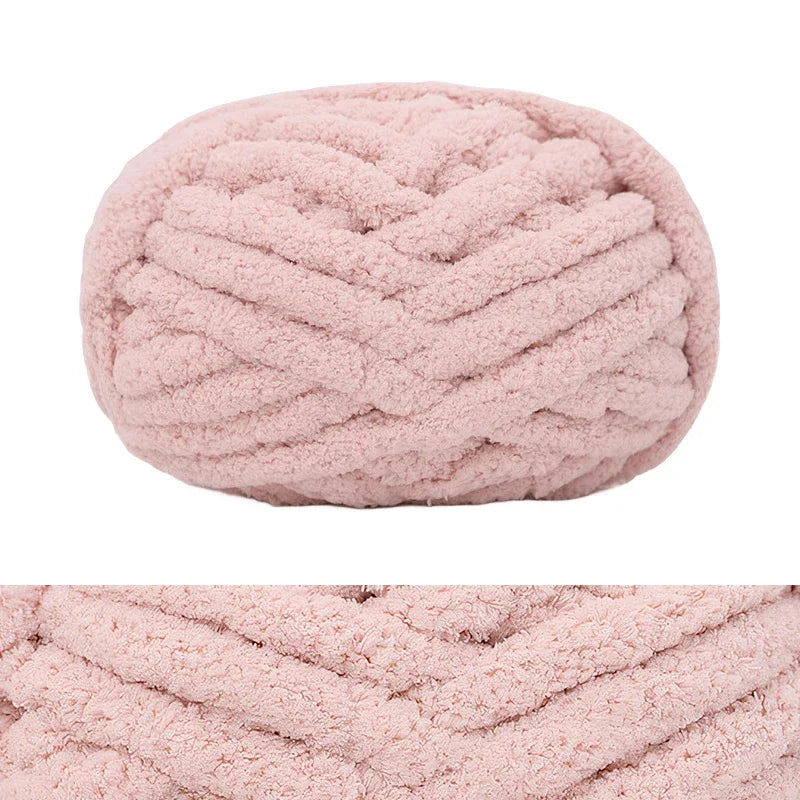 A light pink hand-knitted wool finger line scarf with a textured, ribbed pattern.