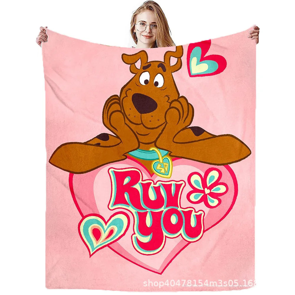 A pink flannel throw blanket featuring a graphic of Scooby-Doo and the text I love you
