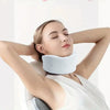 A woman is using an adjustable cervical neck support brace for relaxation or therapy.