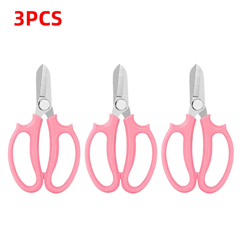 Three pairs of pink precision shears for bonsai and floral work with a comfort grip.