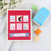 A blue electronic device rests next to a red envelope featuring various pink and green postage stamps on a white background.